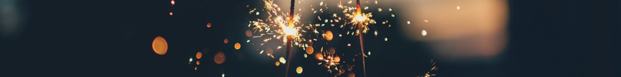 person holding fire cracker shallow focus photography